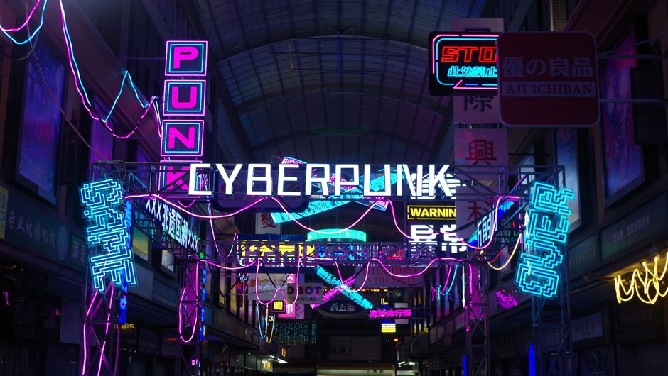 Vibrant neon lights create a cyberpunk aesthetic in a bustling urban alleyway at night.